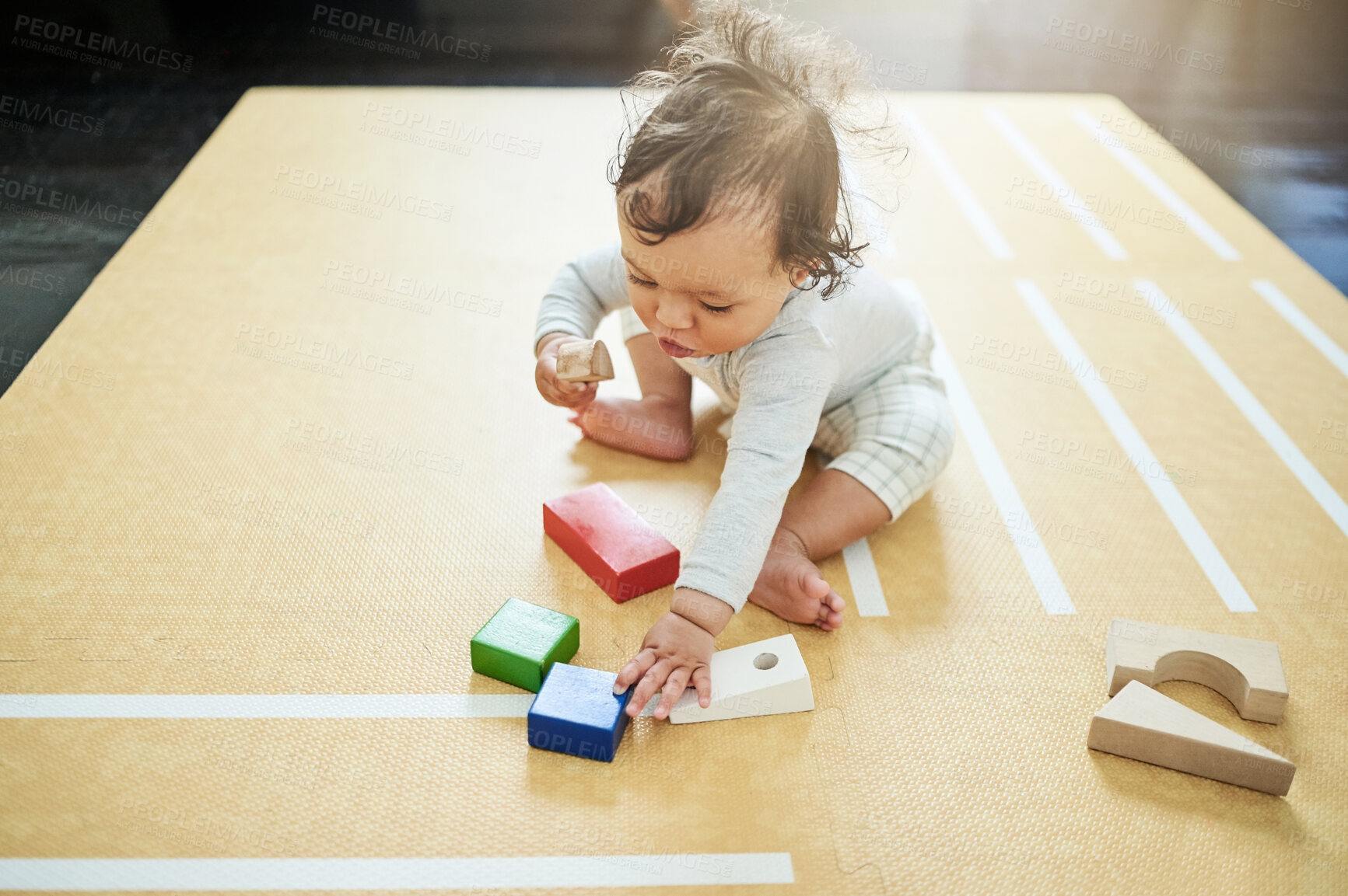 Buy stock photo Baby, boy and playing blocks on floor in nursery, childhood growth or childcare development. Kids, educational toys and games for montessori learning, cognitive puzzle or coordination of motor skills