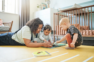 Buy stock photo Babysitter, babies and reading book for learning in home, storytelling or education in house. Development, care or nanny read fantasy with children, kids or toddlers while bonding together in nursery