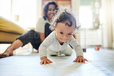 Buy stock photo Mother, family and baby crawling on floor in living room learning to walk, child development and motherhood. Love,  home and happy mom and kid for bonding, quality time and relax together on floor