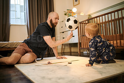 Buy stock photo Dad, child and family home at night for playing with a ball for fun in a bedroom. Man or father with toddler kid floor carpet for quality time, drawing and bedtime bonding or learning football trick