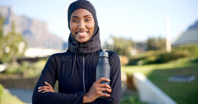 Buy stock photo Muslim, portrait and black woman with water bottle for outdoor fitness, health or wellness in park. Islam, active or female person with smile, liquid or beverage for sustainability or hydration