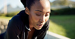 Fitness, exercise and female runner rest outdoor for fatigue, tired and break on run in park. Breathe, exhausted and black woman with healthy lifestyle, training and cardio workout for wellness
