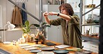 Pottery, man and picture in shop with phone, website and social media marketing for small business. Person, clay product and photography in store with tech, content creation and post for art seller.
