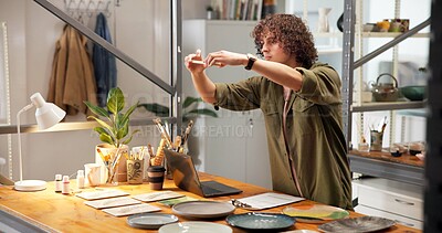 Buy stock photo Pottery, man and picture in shop with phone, website and social media marketing for small business. Person, clay product and photography in store with tech, content creation and post for art seller.