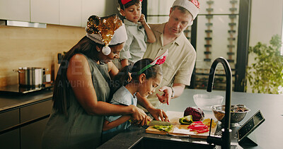 Buy stock photo Parents, children and help on Christmas with cooking, cut vegetables or support with holiday food. Bonding, interracial family or kid in home with meal prep, ingredients or assistance with xmas lunch
