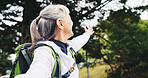 Smile, old woman and hiking in forest with selfie, photography and social media for holiday post. Pov, senior person and sightseeing in nature for backpacking, profile photo update and capture memory