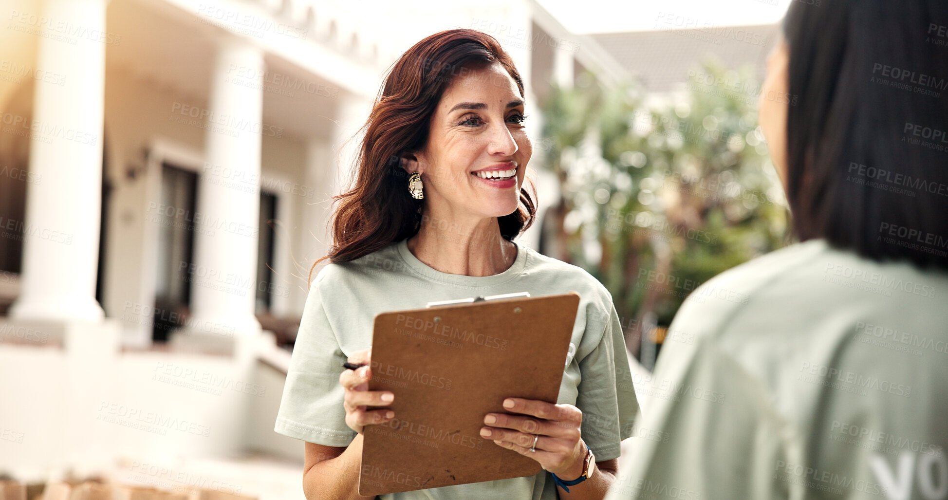 Buy stock photo Clipboard, volunteer and happy woman with colleague for team donation, checklist or charity campaign. Female person, activist or community service with smile or teamwork for outdoor outreach together
