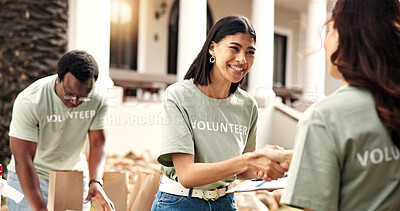 Buy stock photo Clipboard, volunteer or happy woman with handshake for donation, checklist or charity campaign. Female person, activist and shaking hands with smile for community service or outdoor outreach together