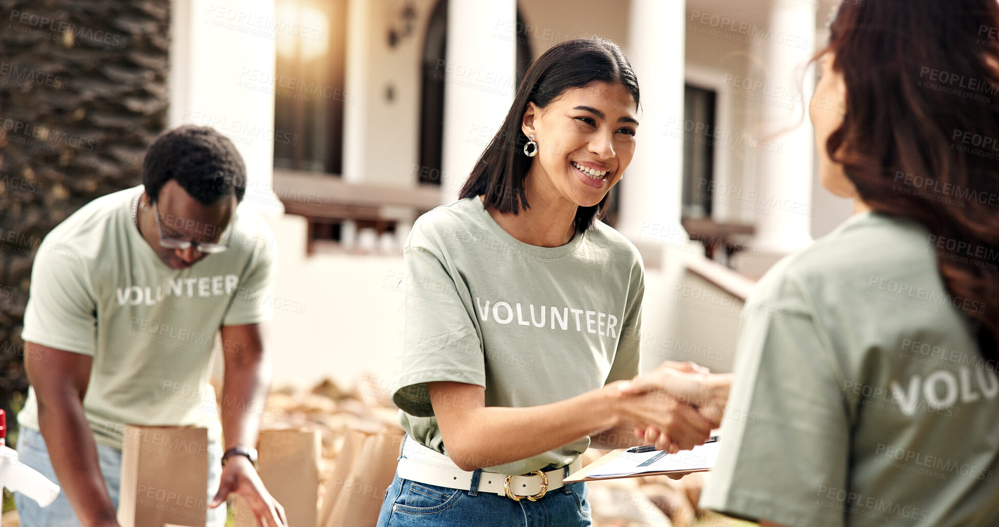Buy stock photo Clipboard, volunteer or happy woman with handshake for donation, checklist or charity campaign. Female person, activist and shaking hands with smile for community service or outdoor outreach together