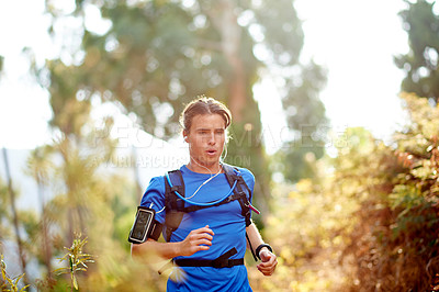 Buy stock photo Running, health and man in forest, fitness and cardio with endurance, breathing and wellness. Person, outdoor and athlete in woods, challenge or training with nature, workout or practice with routine