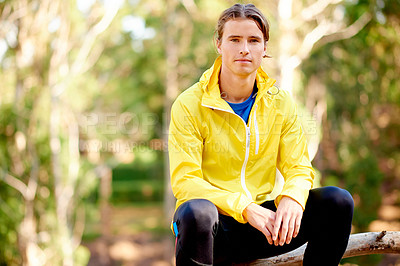 Buy stock photo Portrait, athlete and man relax in forest for fitness, exercise and break of cardio training. Male person, runner and rest for recovery, workout and morning routine with marathon practice in nature