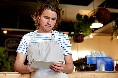 Buy stock photo Tablet, reading and waiter or man in cafe for inventory, menu planning and supply stock order. Restaurant server, digital checklist and search with male person in coffee shop as small business
