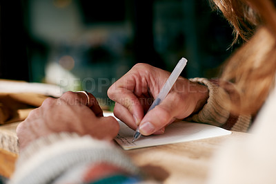 Buy stock photo Hands, person and writing in notepad in home for journal entry, planning schedule and reflection. Agenda, man and pen with notebook in house for inspirational notes, task planner and diary letter