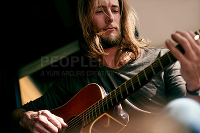 Buy stock photo Man, play guitar and music in home, creativity and low angle for thinking with songwriting process. Person, musician and artist with string instrument, practice or inspiration with sound at house