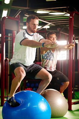 Buy stock photo Squat, balance or people with ball for gym class for mobility practice, training or workout. Athlete, teaching or strength coach in club with stability trainer for teamwork, fitness or exercise
