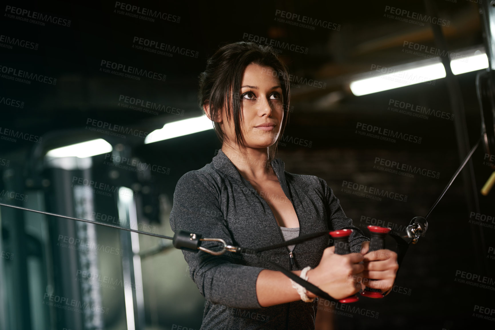 Buy stock photo Gym, woman and cable fly machine in club for strength, wellness and bodybuilding exercise. Active, challenge and female athlete in training with weight equipment for muscle growth, workout or fitness