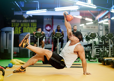 Buy stock photo Man, movement and kettlebell for weightlifting in gym, fitness or strength training with equipment for balance. Energy, exercise and weights workout with moving, power routine for muscle and sport