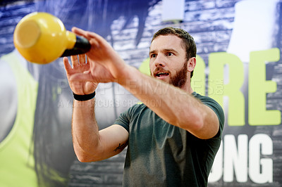 Buy stock photo Gym, man and kettlebell workout for exercise, power and sports challenge for muscle. Balance, bodybuilder and heavy weights for training with health club, fitness and athlete for wellness routine