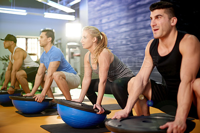 Buy stock photo Medicine ball, fitness and athletes with personal trainer in gym for core strength workout together. Squat, equipment and people with health coach for balance training with wellness in sports center.
