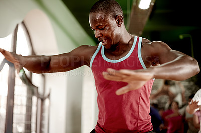 Buy stock photo Man, jump and workout for fitness at gym, smile and challenge at training club for agility development. Person, happy and intense with balance, sweat and routine for wellness at exercise center