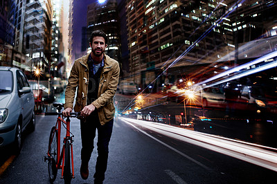 Buy stock photo Night, city and business man with bicycle in street for commute, walking and journey to work. Travel, urban town and person with bike for eco friendly, sustainable and carbon neutral transport