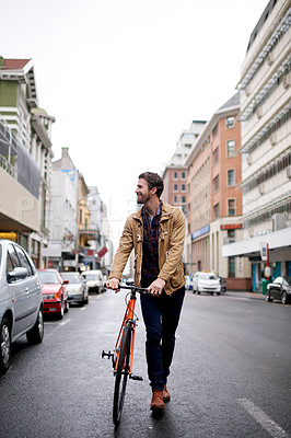 Buy stock photo Smile, man and walking with bicycle in city for travel, tourist sightseeing and eco friendly transport. Happy, male person and bike for morning commute, sustainable journey and adventure for vacation
