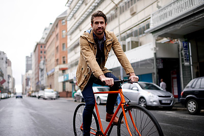 Buy stock photo Travel, portrait and man on bicycle in city for eco friendly transportation, morning commute and journey. Sustainable bike, outdoor and person on street for ride, smile and cycling on road for trip