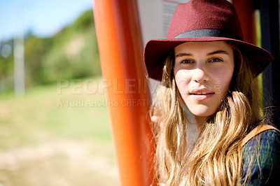 Buy stock photo Portrait, girl and waiting at bus stop in city for travel, public transport and sightseeing abroad. Female teenager, relax and exploring for taxi delay, morning commute and getaway trip for holiday
