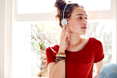 Buy stock photo Girl, headphones and relax in home with music for entertainment, streaming or podcast tech in apartment. Radio, audio and female teenager listening with playlist, break and chilling on weekend