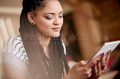 Buy stock photo Home, woman and relax with tablet for app, online communication or reading ebook. African person, living room and digital technology for social media, check email or blog post on internet on weekend