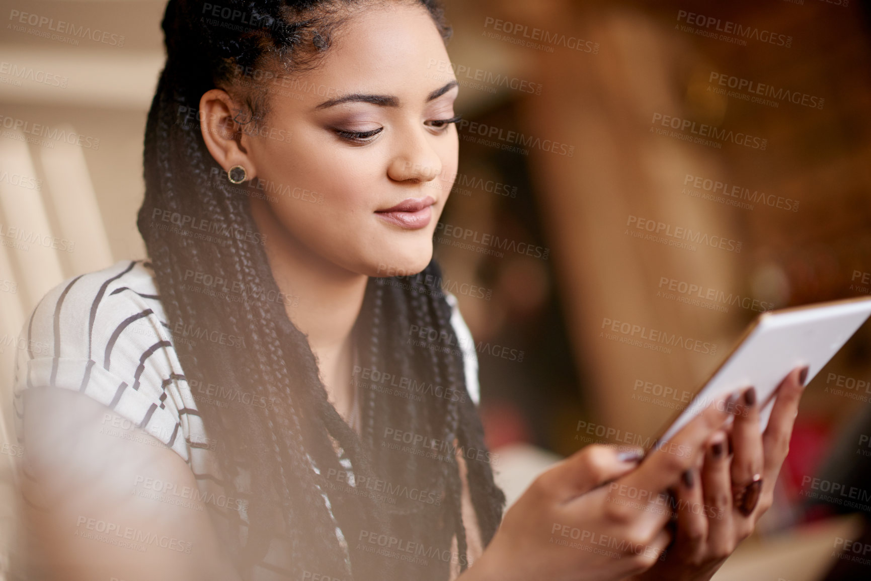 Buy stock photo Home, woman and relax with tablet for app, online communication or reading ebook. African person, living room and digital technology for social media, check email or blog post on internet on weekend