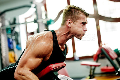 Buy stock photo Fitness, man and dumbbell in gym for weightlifting, arm muscle development or intense workout. Bodybuilder, exercise and sweating with weight for strength training, commitment or sport activity