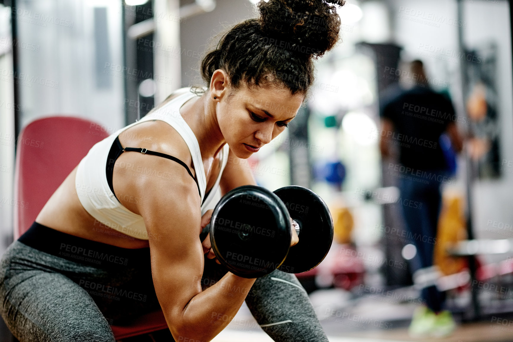 Buy stock photo Training, woman and dumbbell for weightlifting, workout and fitness in gym for health and power. African person, bodybuilder and strength for muscle development, challenge or exercise for wellness