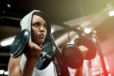Buy stock photo Below, woman and dumbbells for fitness at gym for exercise, intense training and weightlifting. African female person, equipment and power workout with bodybuilder, strong muscle and bicep challenge