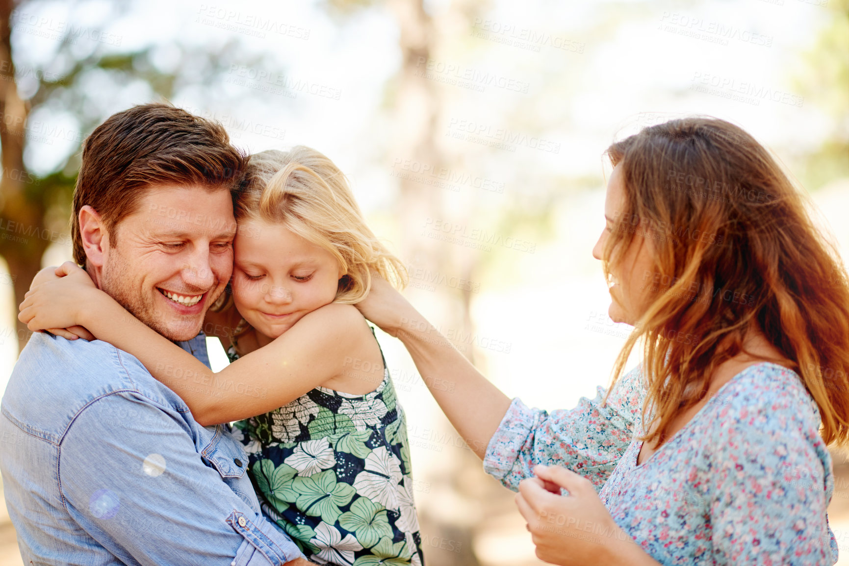 Buy stock photo Outdoor, family and hug in park with smile, relax and bonding on summer holiday for childhood memory. Happiness, mother or father on vacation with child, travel or adventure for wellness trip.