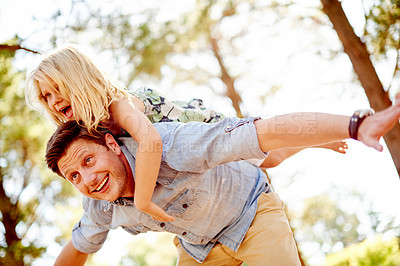 Buy stock photo Happy, father and girl with piggyback at park for airplane game, imagination and fantasy fun. Low angle, dad and carry child on back in nature for playing together, freedom and support with adventure
