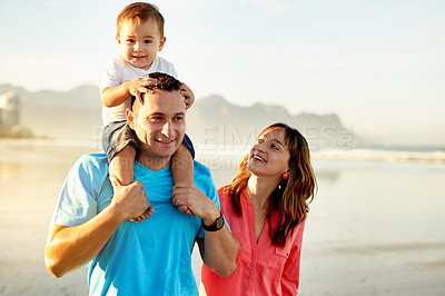 Buy stock photo Walking, parents and child on shoulder at beach for travel adventure, holiday break or fresh air. Happy family, support and father carry baby on seashore for weekend getaway, bonding and mockup space