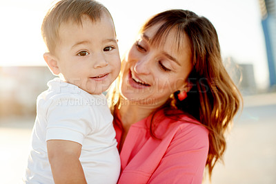 Buy stock photo Relax, family and mom with child at beach for bonding, relationship and smile in nature. Ocean, travel and mother with boy for holiday, vacation and weekend trip for support and sunset adventure