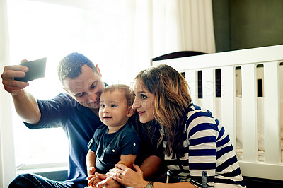 Buy stock photo Family, toddler and picture with selfie in home for photography, memory or bonding together. Dad, mom or people with boy, child or son with app for capture moment or childhood reminder in nursery