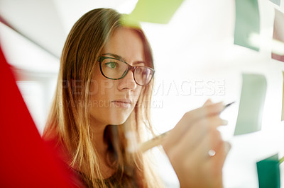 Buy stock photo Thinking, business and woman in office with sticky note, planning and idea to develop strategy. Writing, vision and marketer in creative agency with post it for campaign, media schedule and selection
