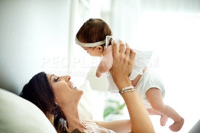 Buy stock photo Happy, child and mother in bedroom with care, love and bonding together for connection. Woman, daughter and playing at home with trust, smile embrace and affectionate for special family memory. 