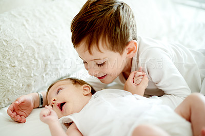 Buy stock photo Baby, bonding or morning with boy in bedroom of home with sibling for development or growth. Family, cuddle or love with brother and infant sister on bed in apartment together for safety or security