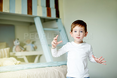 Buy stock photo Playing, kid and boy in bedroom, portrait and home with imagination, creativity and game. Relax, child development and fun with weekend break, autism and growth with fantasy and facial expression