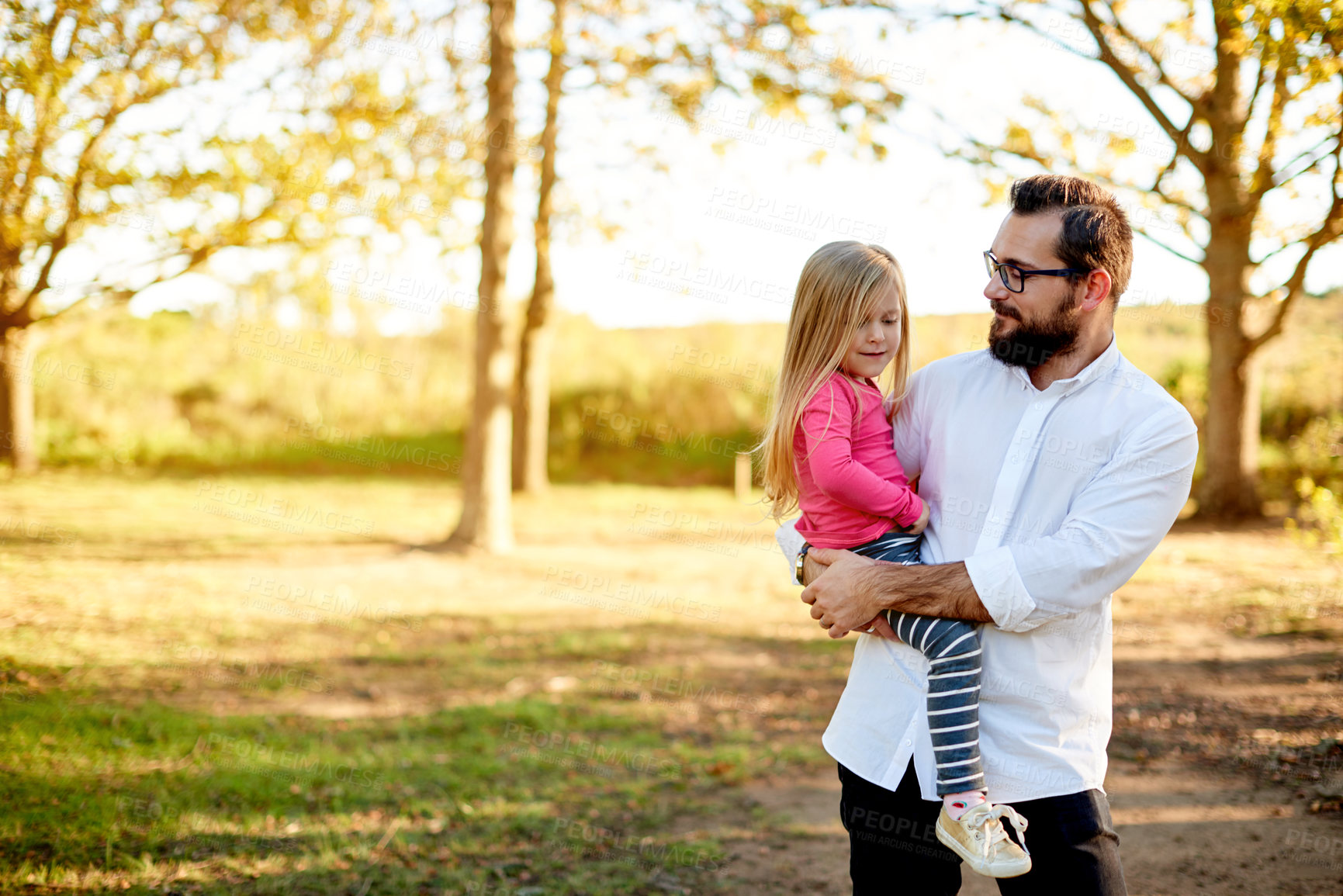 Buy stock photo Outdoor, love and father carrying girl, nature and bonding together with weekend break. Family, single parent and dad in park, daughter and child development with holiday, vacation and explore