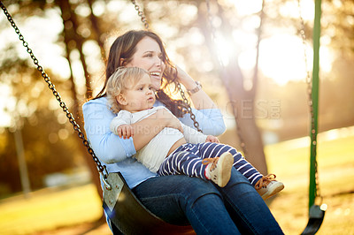 Buy stock photo Park, sunshine and mom with child on swing for fun, adventure and playing together on weekend morning. Family, nature and mother with girl on playground for bonding, relationship and happy outdoor