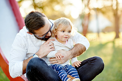 Buy stock photo Playground, happy and dad with child on slide for outdoor adventure, playing and having fun together. Family, summer and father with girl at park for bonding, connection and relationship in nature