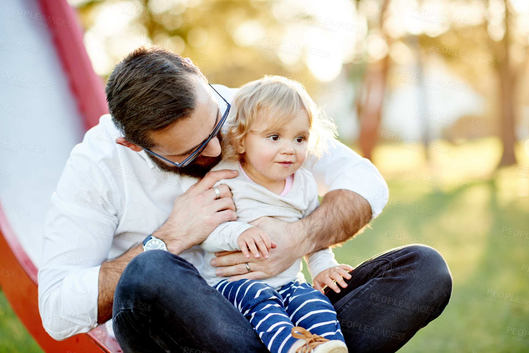 Buy stock photo Playground, happy and dad with child on slide for outdoor adventure, playing and having fun together. Family, summer and father with girl at park for bonding, connection and relationship in nature