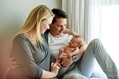 Buy stock photo Bedroom, hug and parents with child in home for loving relationship, bonding and affection. Family, morning and happy mom, dad and newborn baby in house for security, trust and parenting together