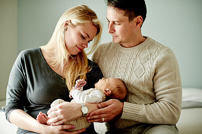 Buy stock photo Smile, love and parents with baby in home with calm, care and growth in family time. Bonding, happy and newborn sleeping with mother and father for support, comfort or trust together in house.