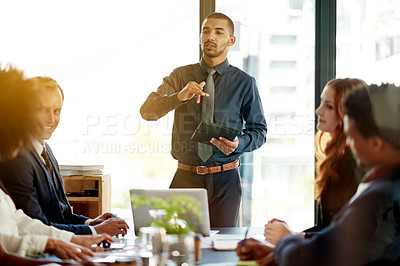 Buy stock photo Presentation, meeting and tablet with business man in office for stakeholder, project proposal and planning. Teamwork, research and collaboration with employees in agency for profit report and review